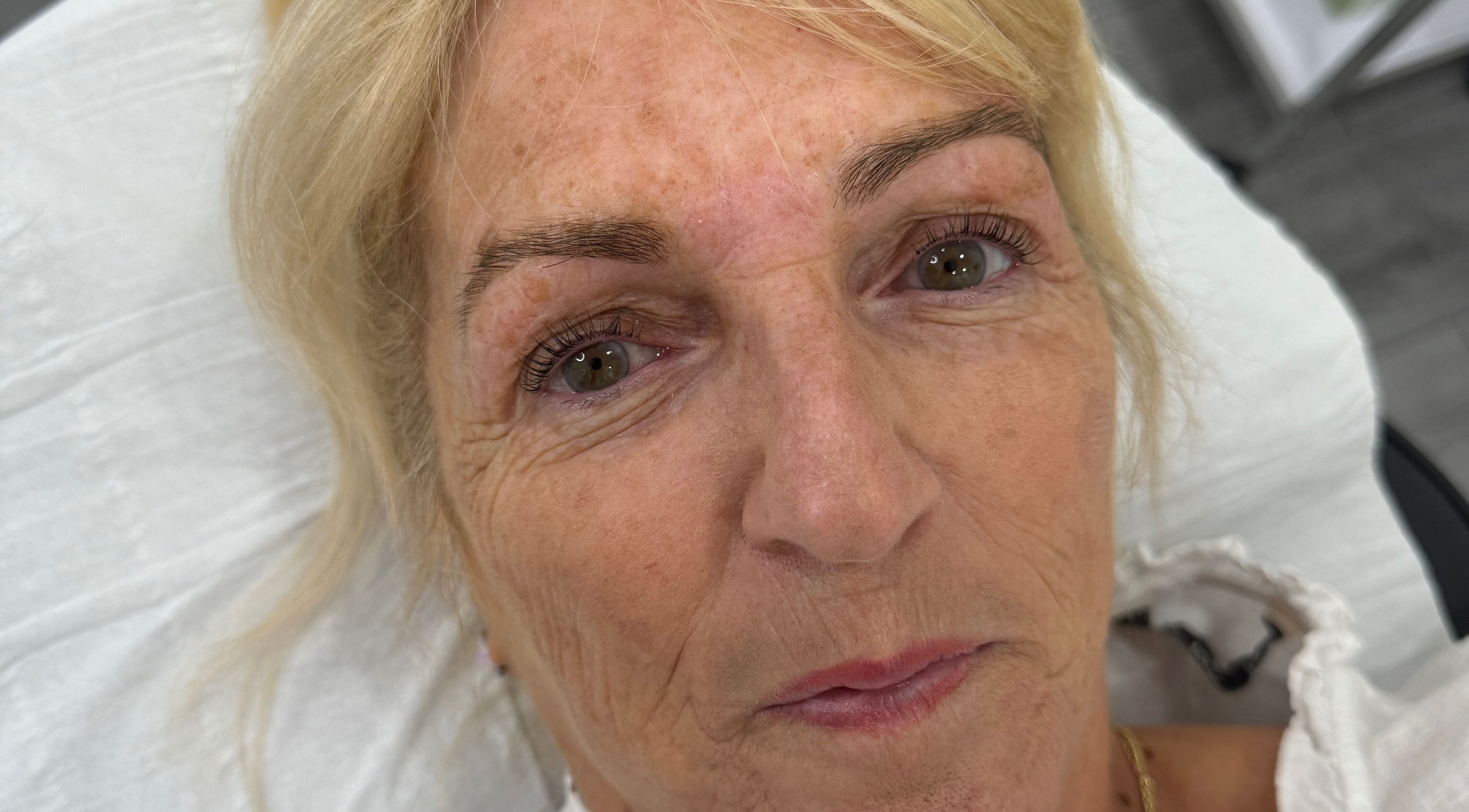 A refreshed client after beauty treatment at Studio by MH, Liverpool, England, GB.