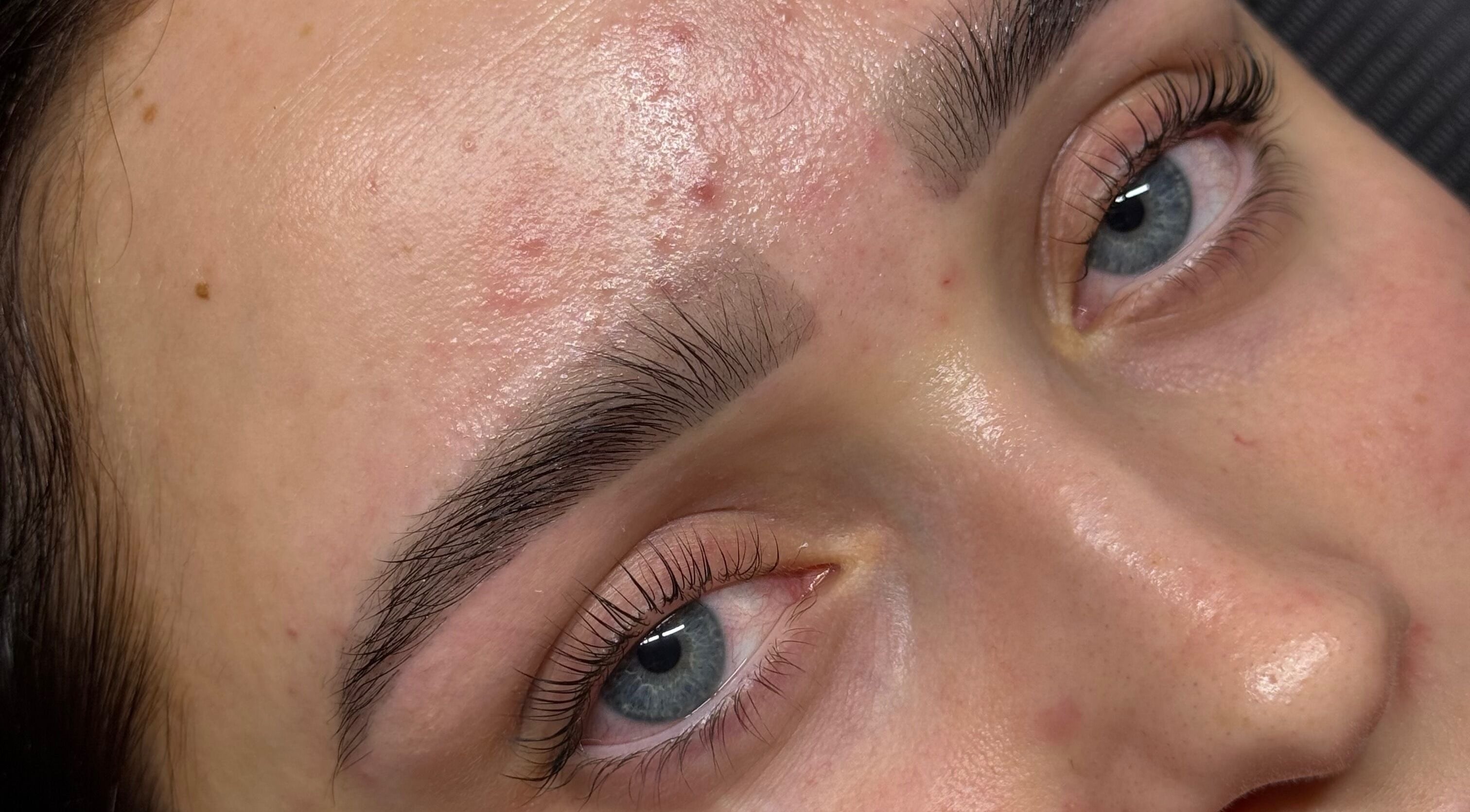 Close-up of well-groomed eyebrows and smooth skin at Studio by MH, Liverpool, England, GB.