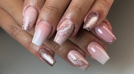 Elegant pink and glitter nail art at Luna Nails, Bradford, England, GB. Professionally styled for a chic look.