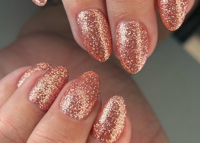Sparkling glitter nails at Luna Nails, Bradford, England, GB offer a glamorous finish.