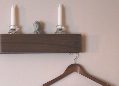 Elegant wooden shelf with candles at Rafaëlle Rotunno Massothérapie, Pointe-claire, Québec, CA.