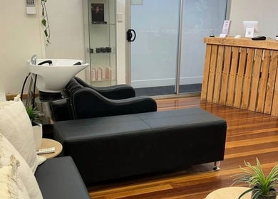 Welcoming salon interior at Lash Muse, Broadbeach, Queensland, AU with comfortable seating and chic decor.
