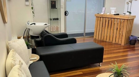 Welcoming salon interior at Lash Muse, Broadbeach, Queensland, AU with comfortable seating and chic decor.