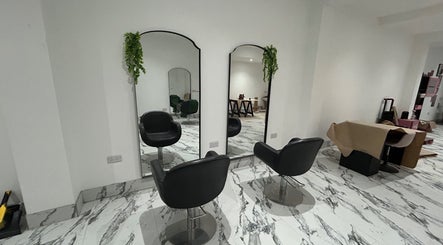 Modern salon interior at KliniKate Aesthetics & Beauty in Darlington, England, GB featuring stylish mirrors and chairs.
