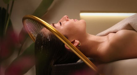 Relaxing spa treatment at Gili Head Spa, New York, New York, US with water gently flowing over hair.