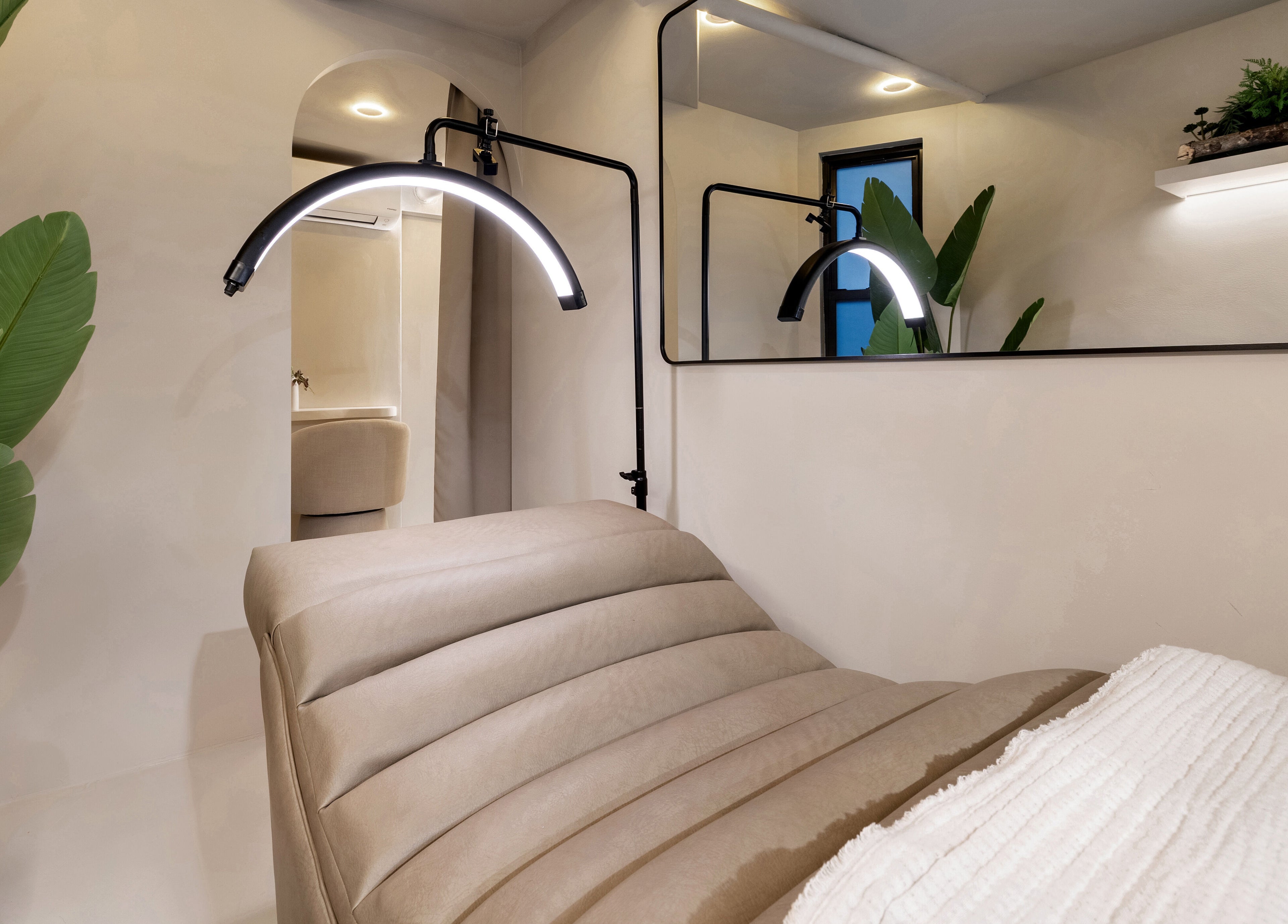 Cozy treatment room at Gili Head Spa, New York, New York, US with ambient lighting and natural decor.