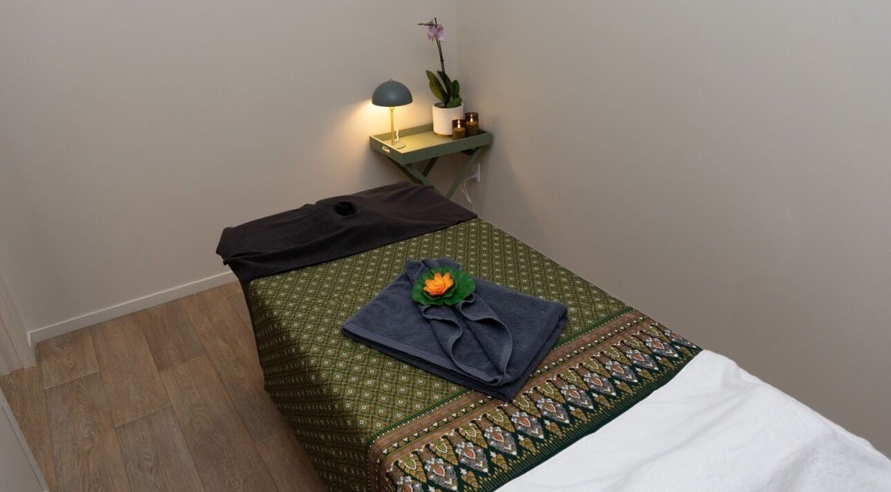 Relaxing massage room at INLUX Thai Massage & Spa, Pukekohe, Auckland, NZ with cozy decor and ambient lighting.