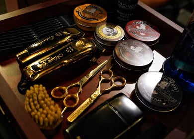 Haircut tools and styling products at Kingsmen Barbershop, Dubai, Dubai, AE for classic grooming.