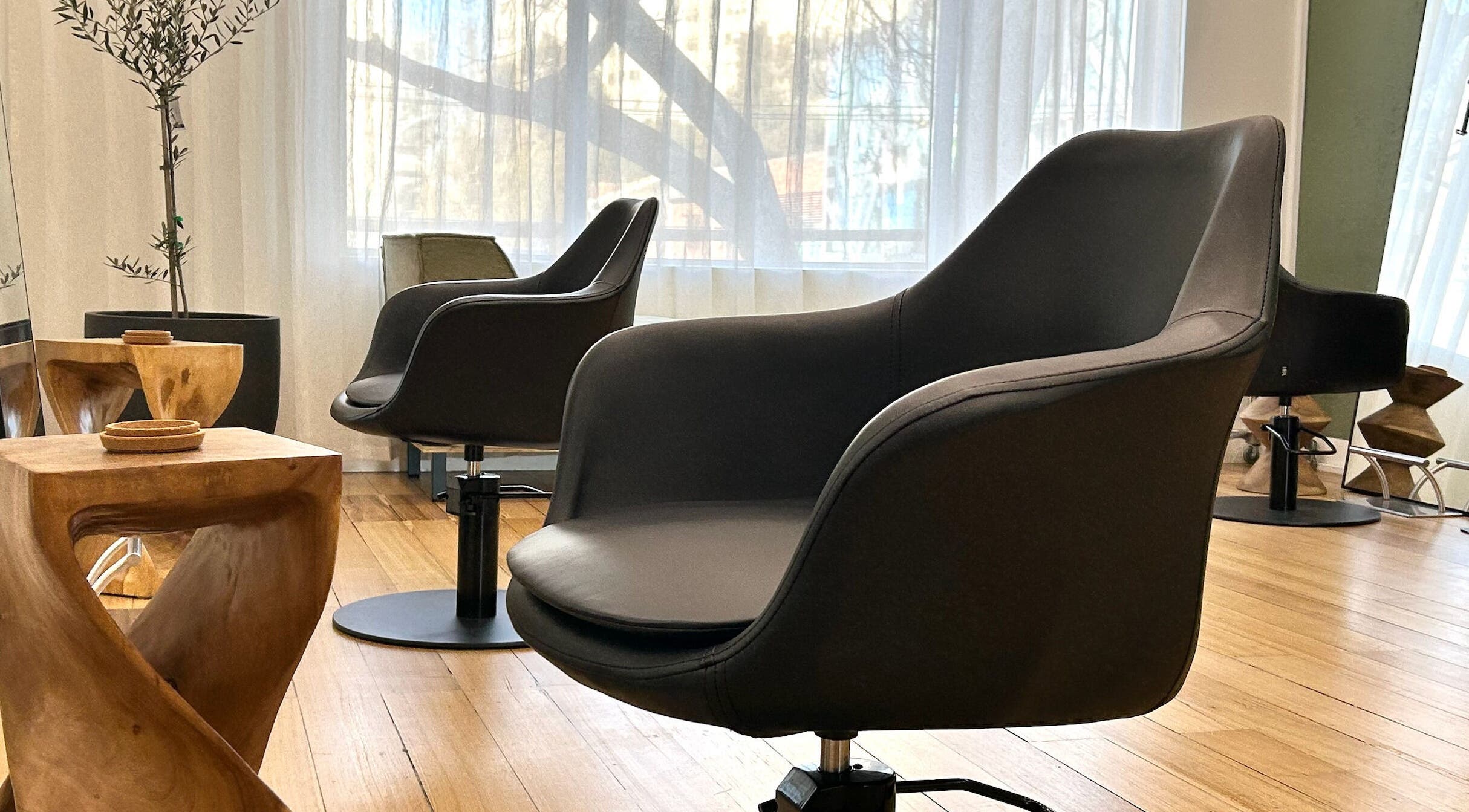 Stylish salon chairs and decor at Joey Myers Hair, South Yarra, Victoria, AU.