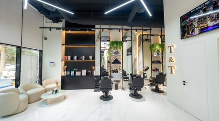 Modern interior of Trim & Tame Men Saloon in Dubai with stylish chairs and sleek decor.