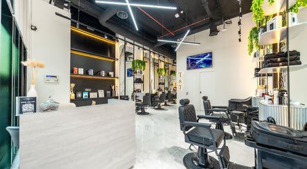 Modern interior of Trim & Tame Men Saloon in Dubai, Dubai, AE with sleek chairs and elegant decor.