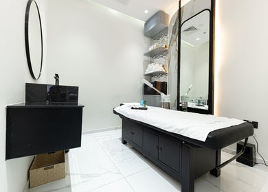 Modern treatment room at Trim & Tame Men Saloon, Dubai, Dubai, AE with elegant decor and amenities.