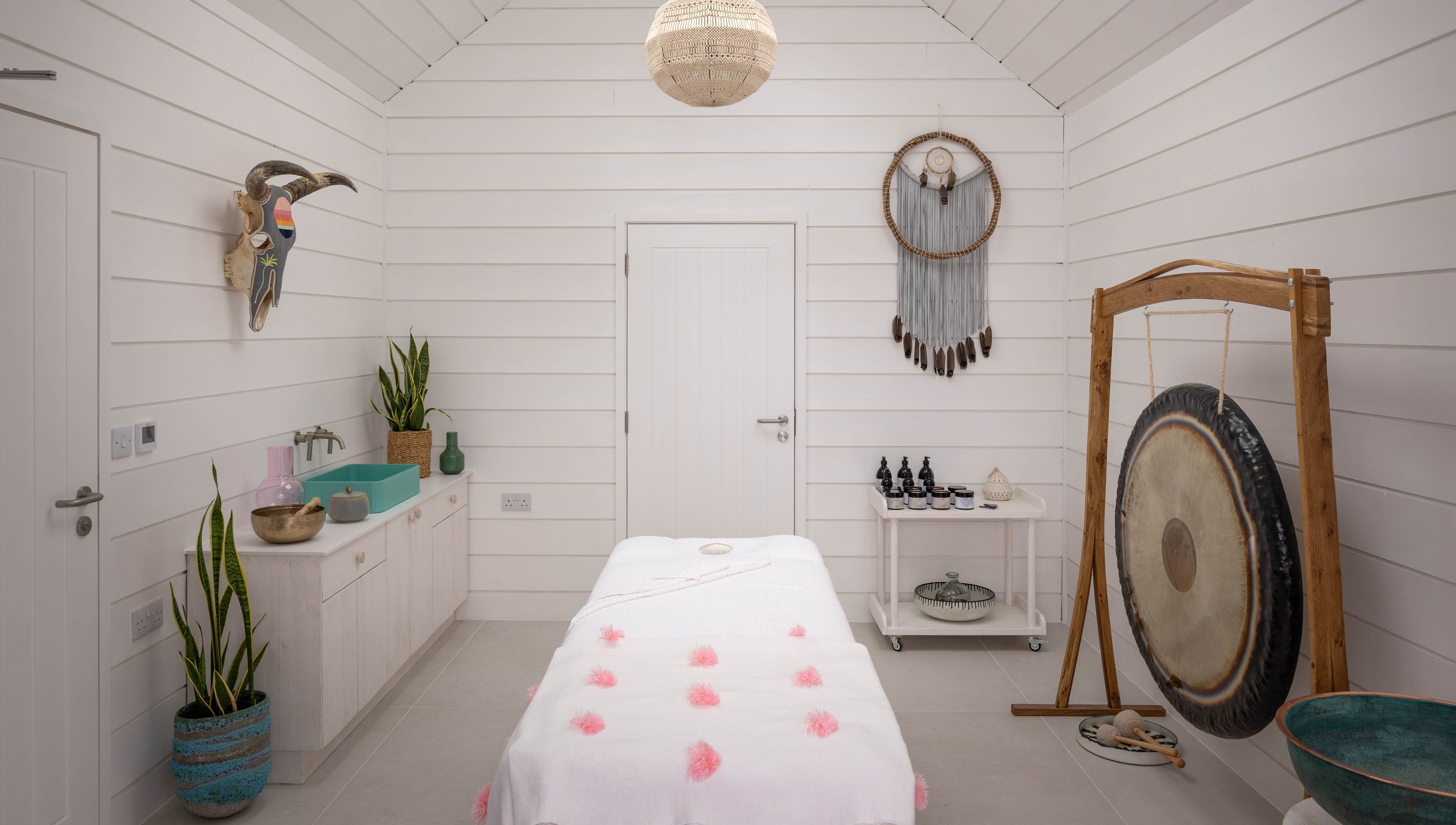 Relax at Three Mile Beach spa room with serene decor in Gwithian, England, GB.