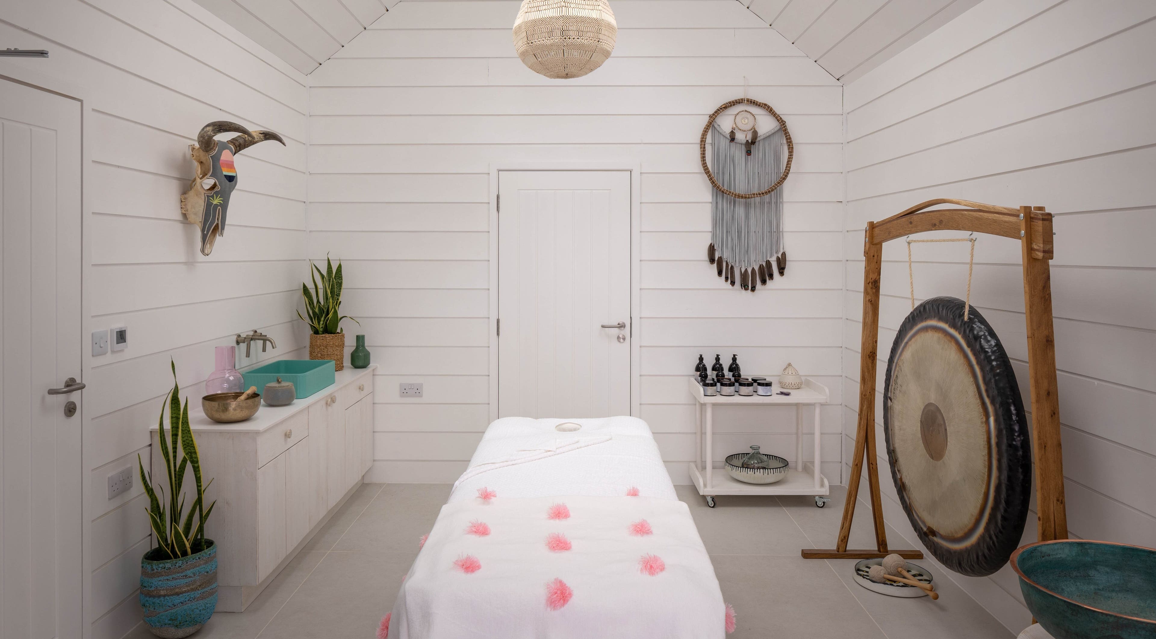 Relax at Three Mile Beach spa room with serene decor in Gwithian, England, GB.