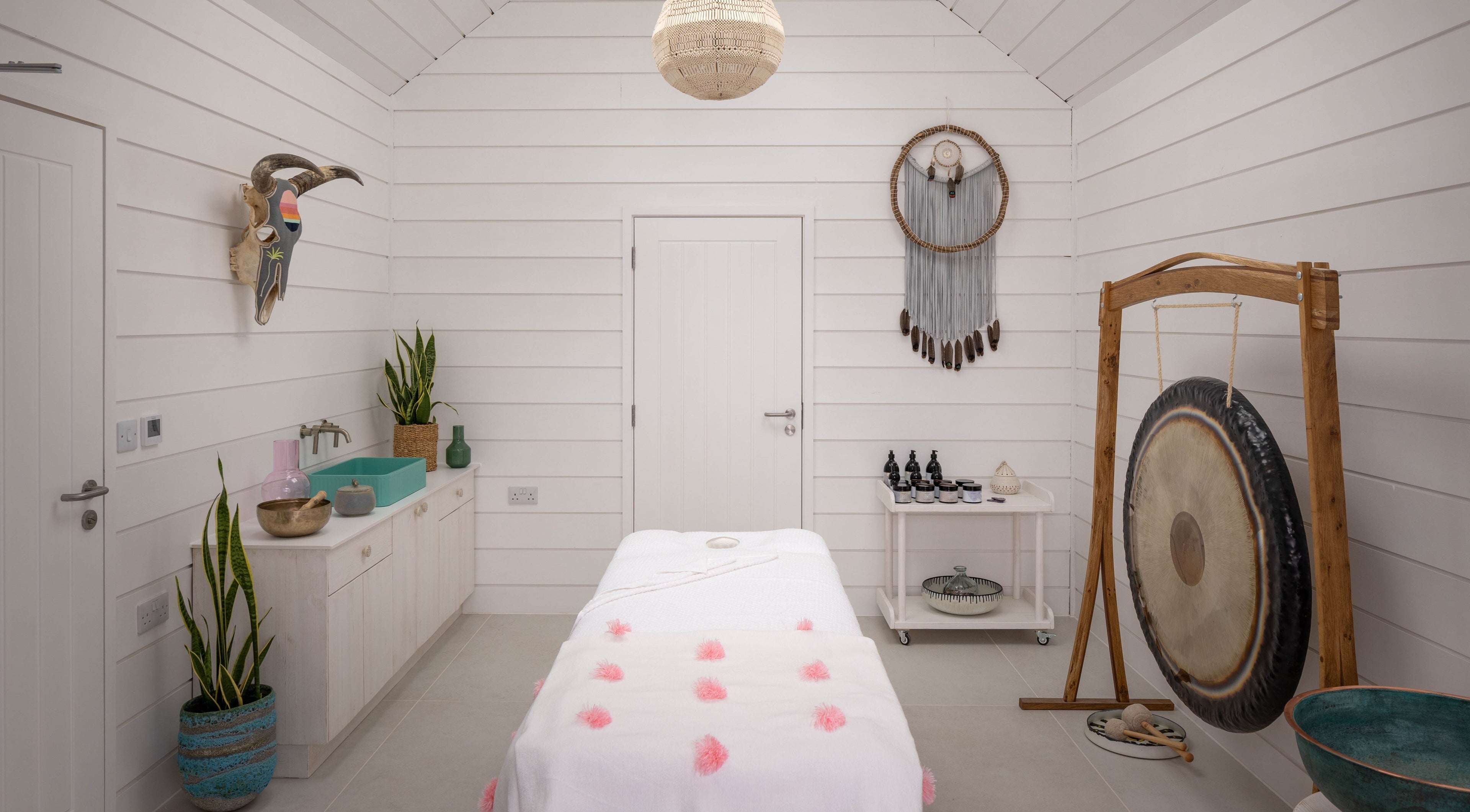 Relax at Three Mile Beach spa room with serene decor in Gwithian, England, GB.