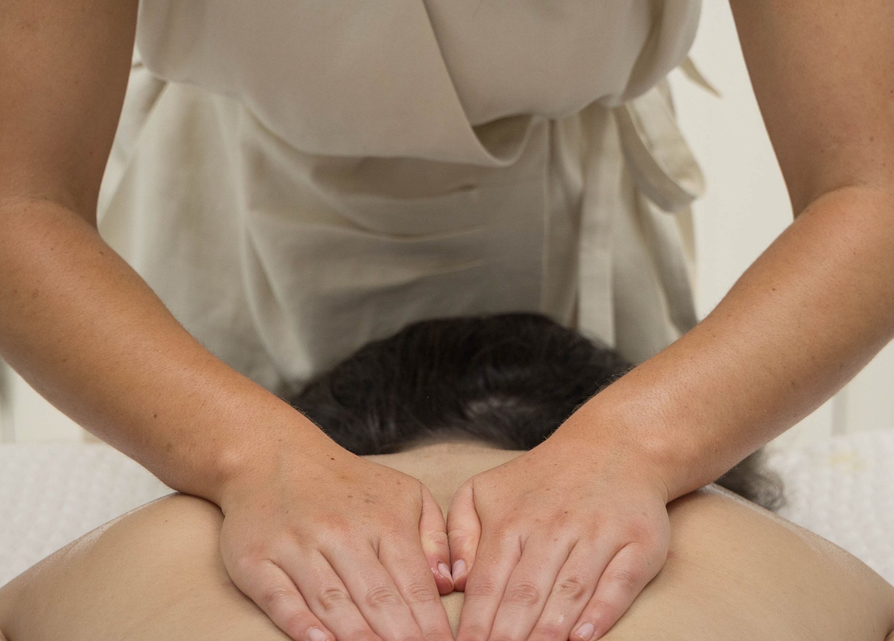 Massage therapy session at Relax at Three Mile Beach in Gwithian, England, GB enhancing relaxation.