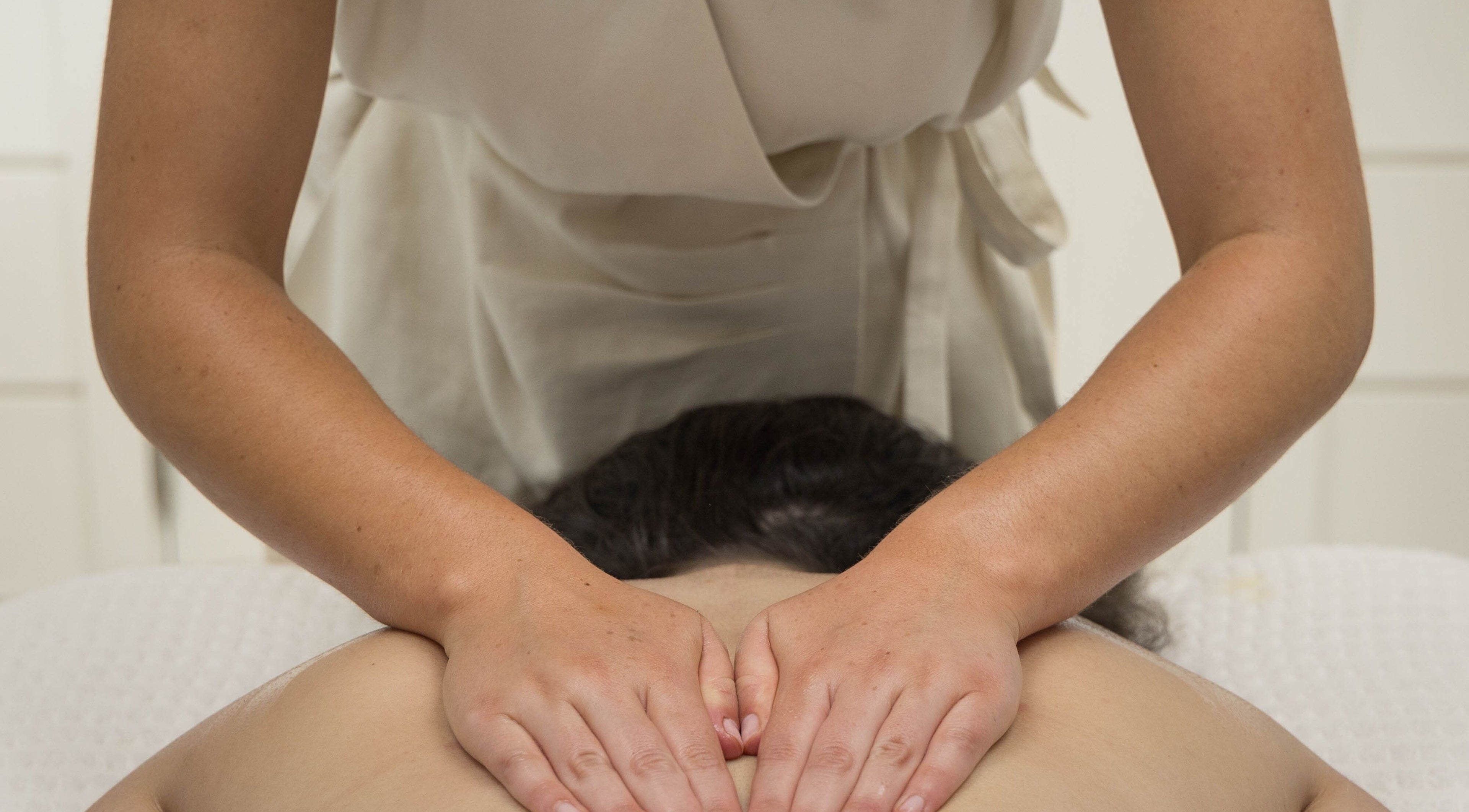 Massage therapy session at Relax at Three Mile Beach in Gwithian, England, GB enhancing relaxation.