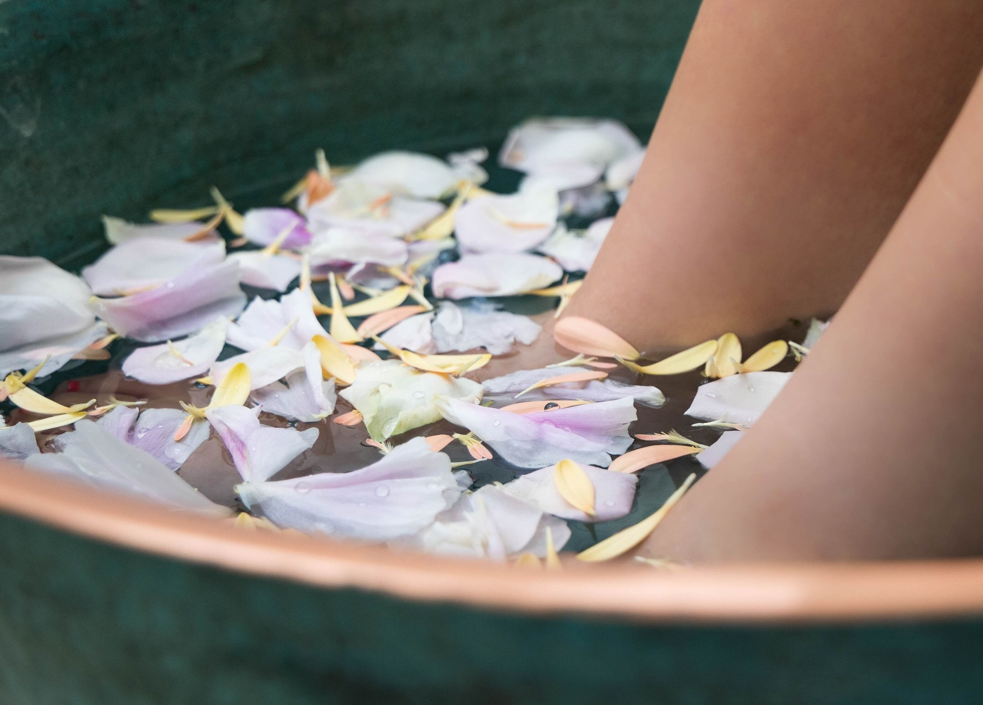 Relax at Three Mile Beach Gwithian, England, GB: foot soak with petals offers ultimate relaxation.