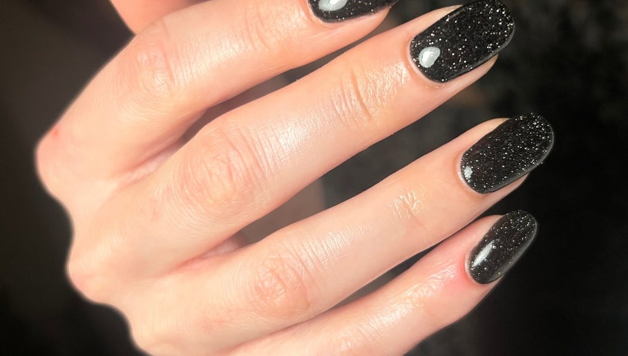 Elegant black glitter nails at Nails By Kate, Stamford Bridge, England, GB.