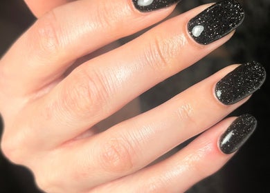 Elegant black glitter nails at Nails By Kate, Stamford Bridge, England, GB.