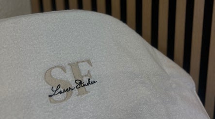 SF LASER branded towel at Dereham, England, GB. Perfect blend of luxury and comfort for wellness treatments.