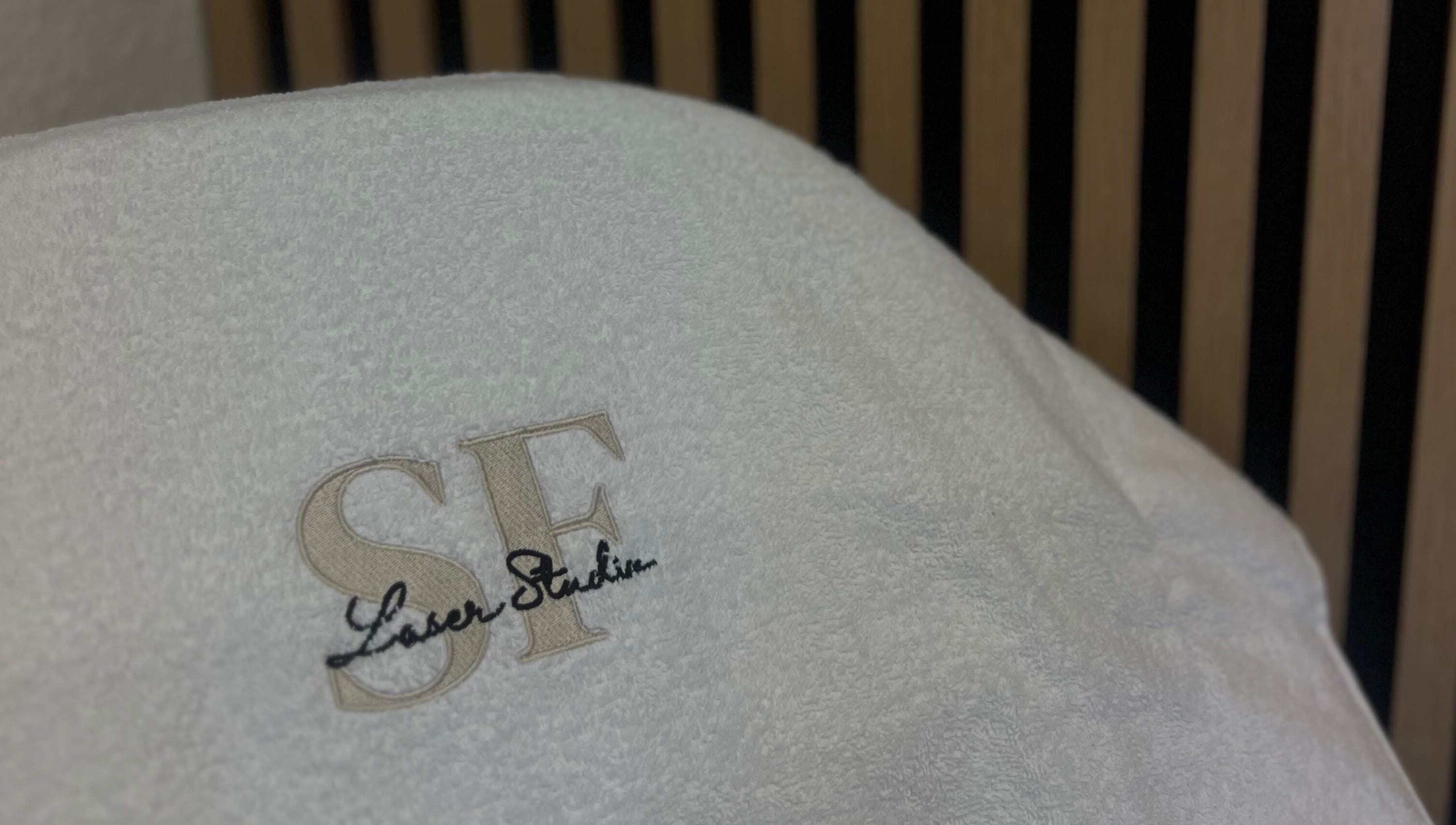 Embroidered SF LASER towel in Dereham, England, GB, offering premium beauty and wellness services.