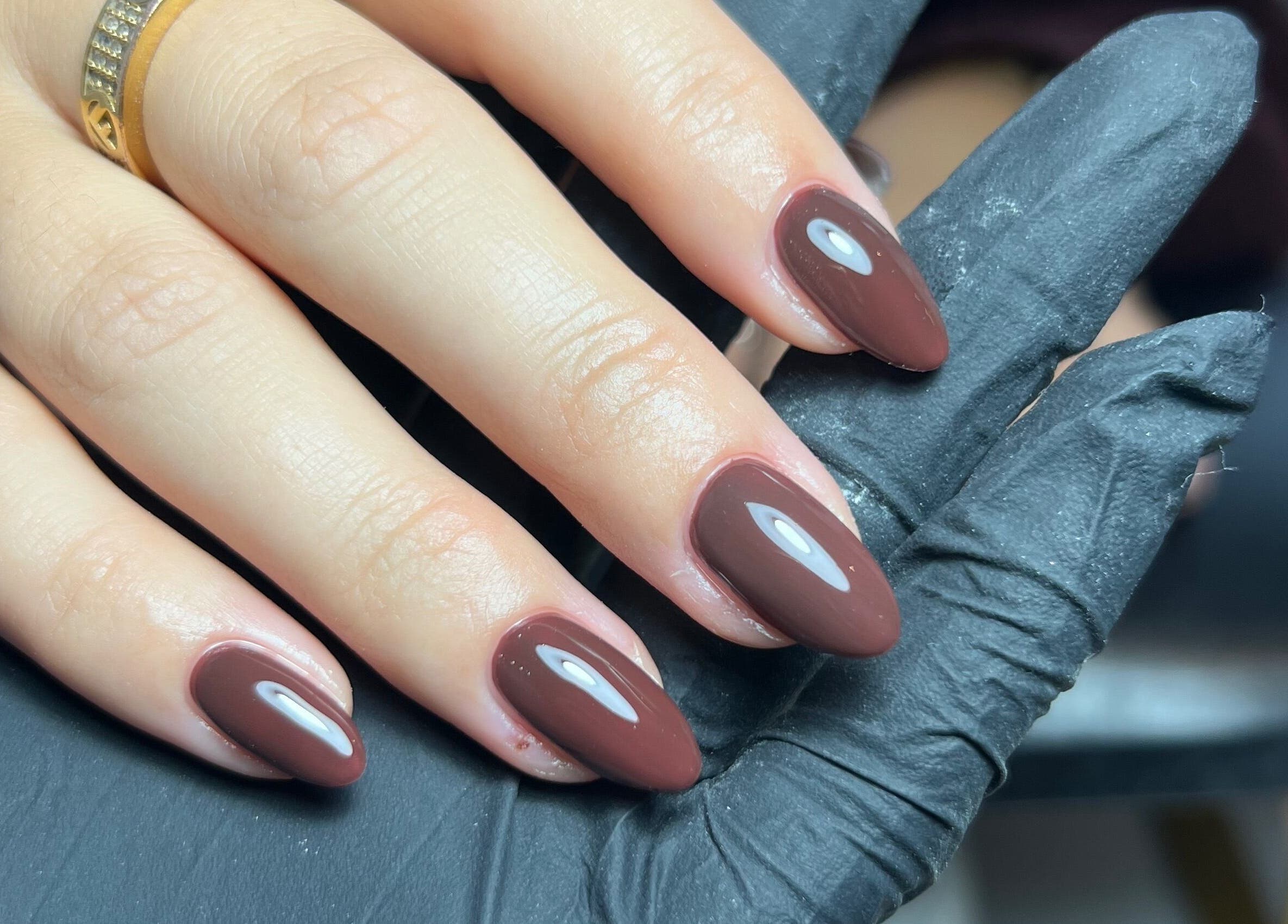 Elegant brown manicure at SF LASER in Dereham, England, GB, showcasing professional nail artistry.