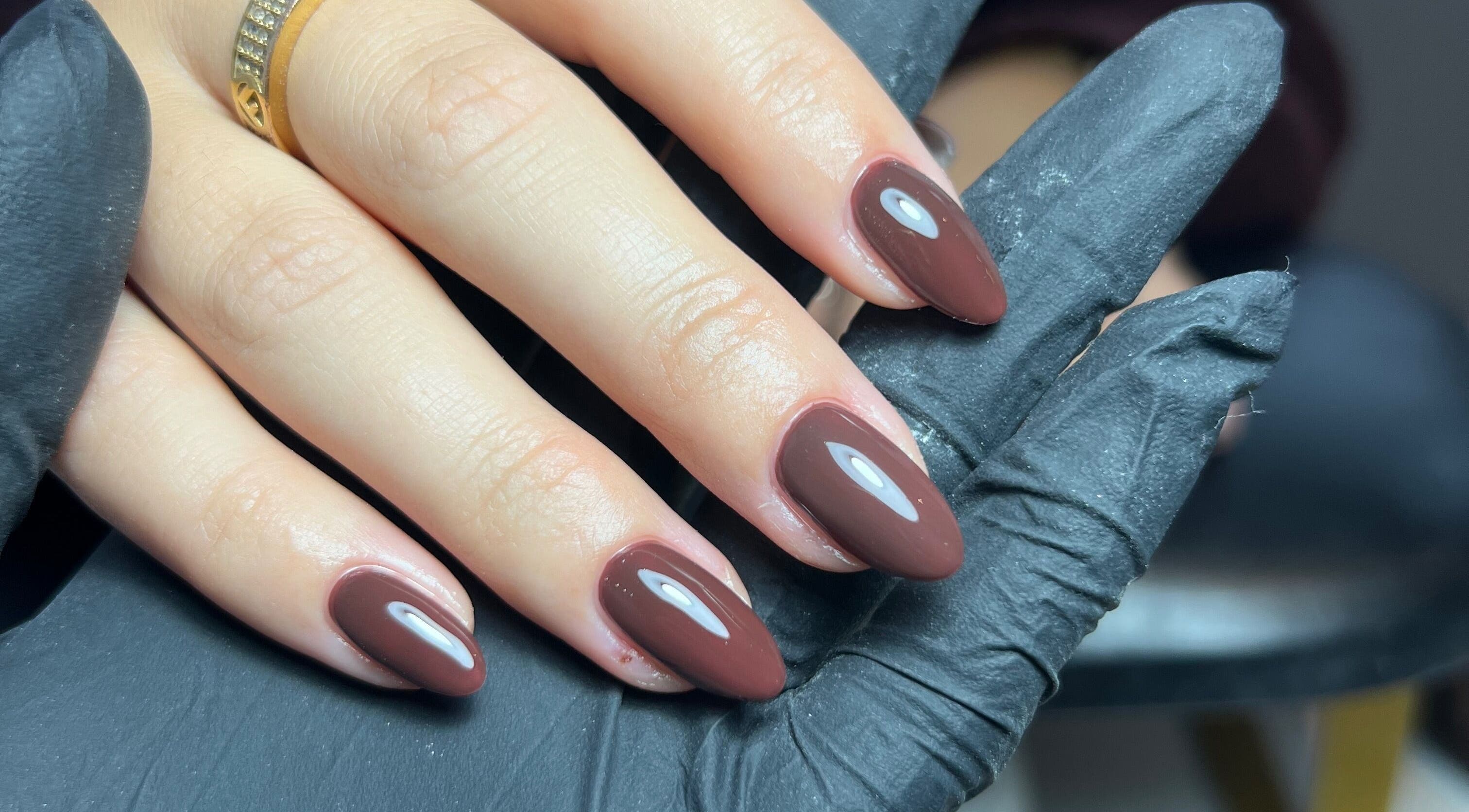 Elegant brown manicure at SF LASER in Dereham, England, GB, showcasing professional nail artistry.