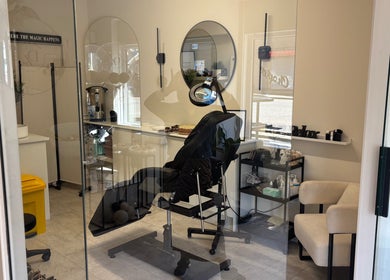 Cozy treatment room at Dzen Clinic, Crossgates, Scotland, GB with sleek decor and modern therapeutic chair.
