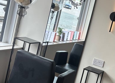 Chic seating area in Dzen Clinic, Crossgates, Scotland, GB, featuring sleek chairs and modern decor.