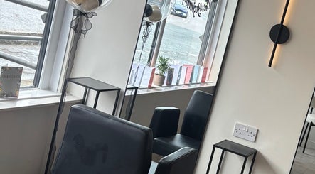 Chic seating area in Dzen Clinic, Crossgates, Scotland, GB, featuring sleek chairs and modern decor.