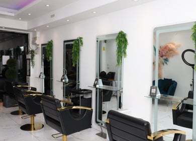 Elegant interior of Dlux beauty salon in London, England, GB with stylish chairs and mirrors.