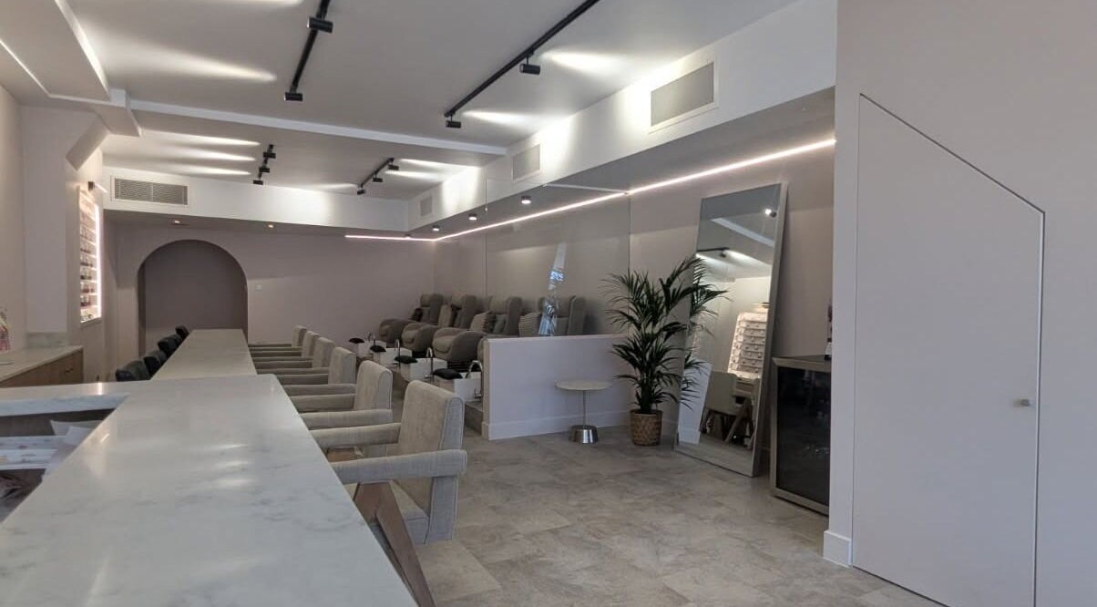 Modern salon interior at néutra, London, England, GB, featuring elegant seating and soft lighting.