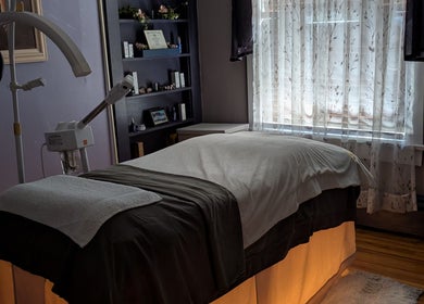 Treatment room at J. Madison Spa, Kingston, PA, US, featuring a massage bed and serene decor.