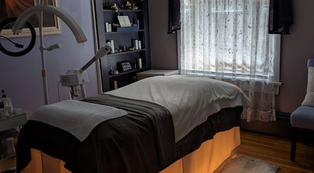 Treatment room at J. Madison Spa, Kingston, PA, US, featuring a massage bed and serene decor.
