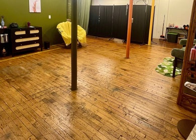 Spacious interior of Rosy Cheeks Beauty Studio with wooden floors in Biddeford, Maine, US.