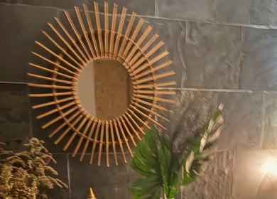 Bamboo-framed mirror at Serenity Sound Healing, London, England, GB highlighting natural decor.