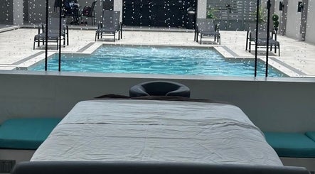 Relaxing poolside view at Solace by Josh in Chaguanas, Chaguanas, TT, perfect for a soothing experience.