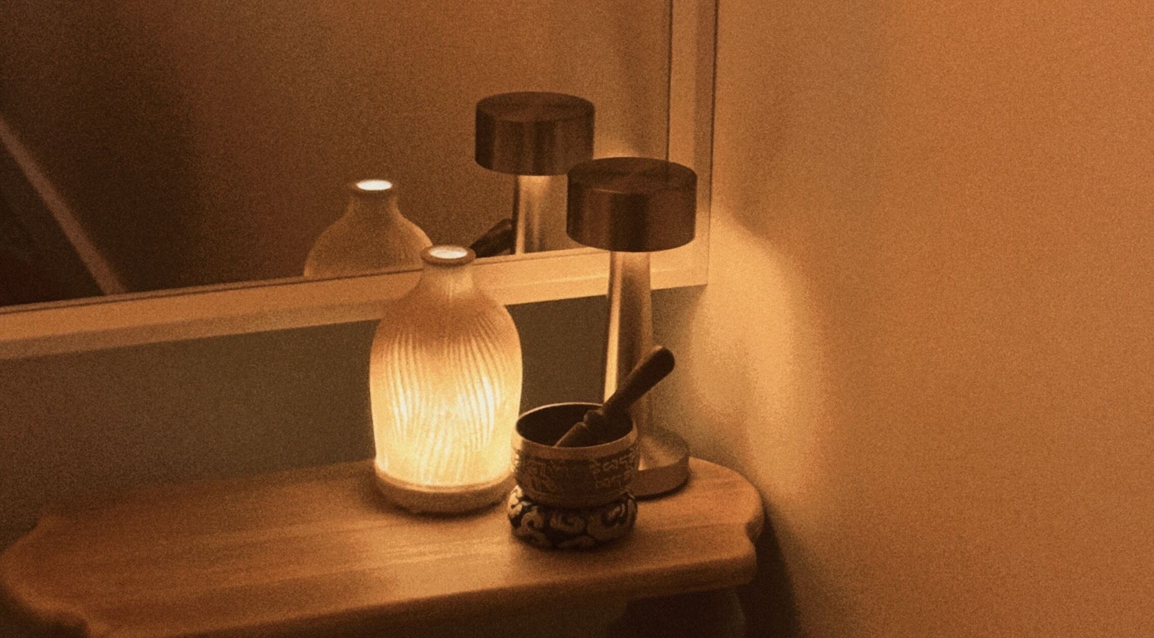 Ambient lighting with candle and decorations at The Serenity Room - Massage Studio, Surfers Paradise, Queensland, AU.
