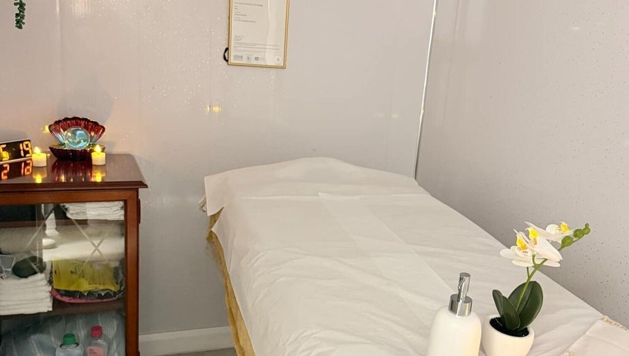 Tranquil massage room at Malai Thai Massacre North Finchley, London, England, GB, featuring cozy decor.