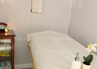 Tranquil massage room at Malai Thai Massacre North Finchley, London, England, GB, featuring cozy decor.