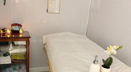 Tranquil massage room at Malai Thai Massacre North Finchley, London, England, GB, featuring cozy decor.