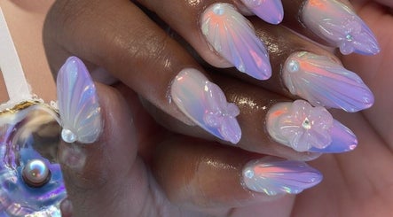 Stunning iridescent nails with floral accents at Aesthetic Nails and Beauty, Melbourne, Victoria, AU.