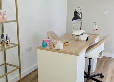 Bright, inviting nail station at MANI.FEST Nails in Barry, Wales, GB, featuring chic decor and essential tools.