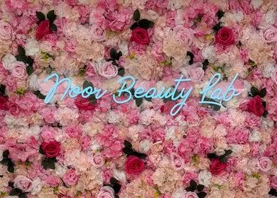 Noor Beauty Lab floral wall with neon sign in Enfield, England, GB.