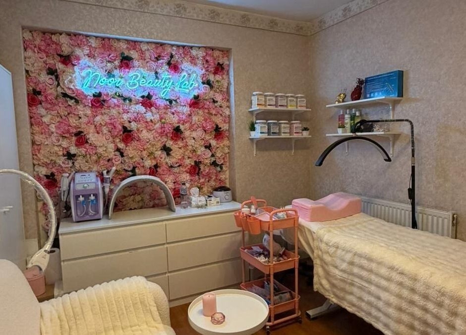 Noor Beauty Lab treatment room with floral wall in Enfield, England, GB.