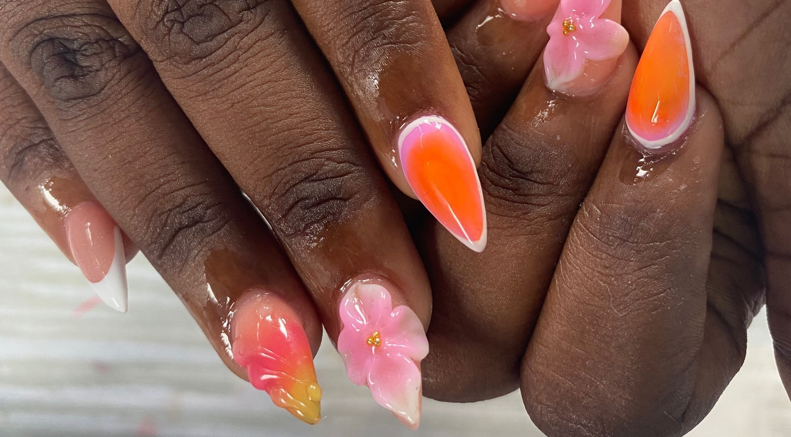 Vibrant floral nail art at NailzbyTan in Biabou, Charlotte VC, showcasing intricate designs and vivid colors.