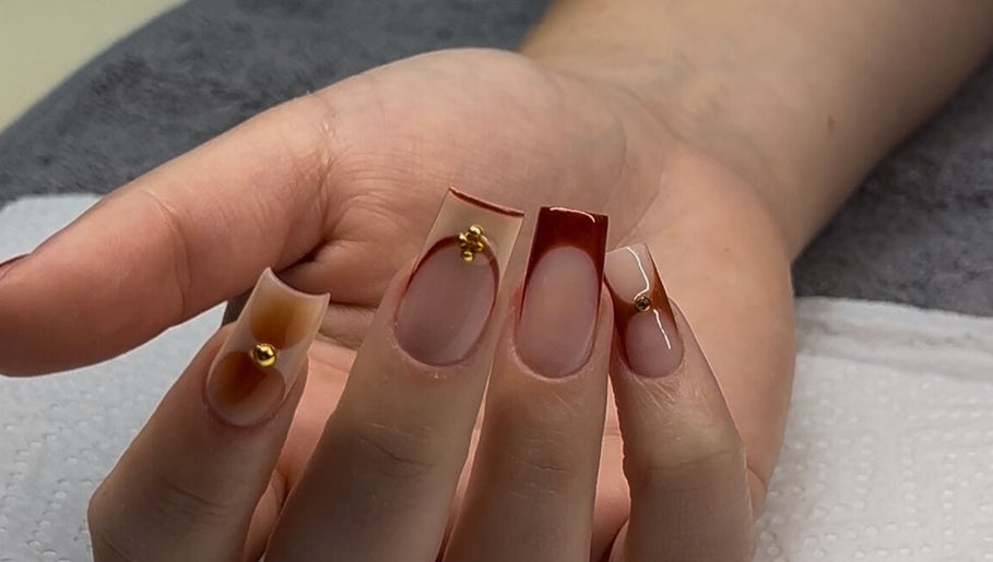 Stylish nail art with gold accents at Nelgai Beauty, Cape Town, Western Cape, ZA.