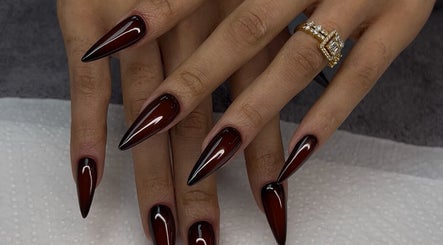 Chic, sharp dark red stiletto nails at Nelgai Beauty, Cape Town, Western Cape, ZA.