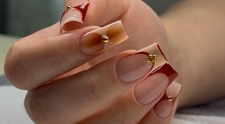 Elegant nail art with gold accents at Nelgai Beauty, Cape Town, Western Cape, ZA.